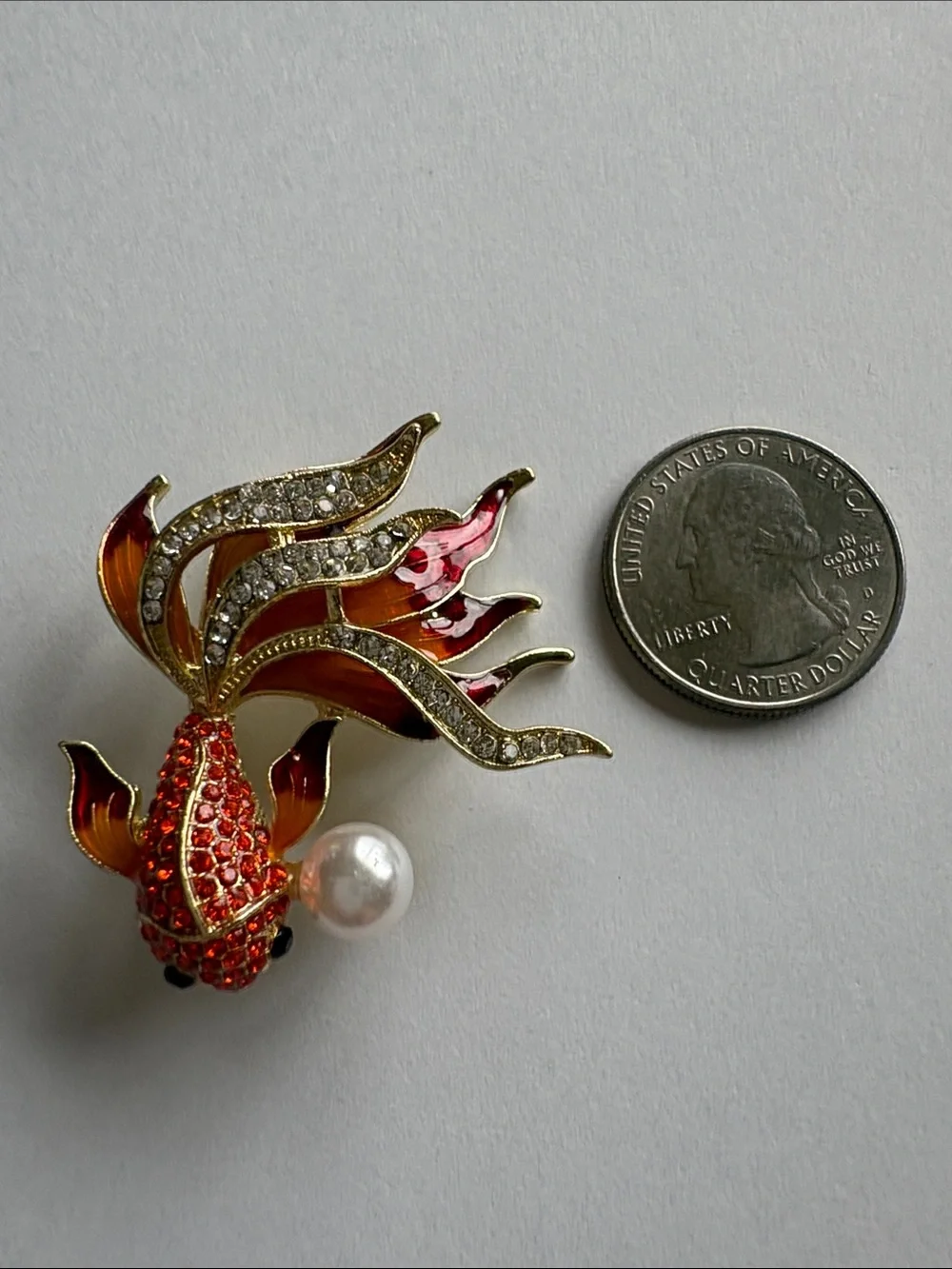 Elegant Gold-Tone Red & Orange Fish Brooch with Pearl Accent